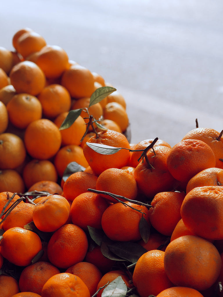 Close up shot of mandarins. Cruce Family Farms is a small citrus grove located in the Sweet Valley Citrus growing region. Our trees are planted in the nutrient dense soils that keep our trees healthy and make our fruit sweet. 